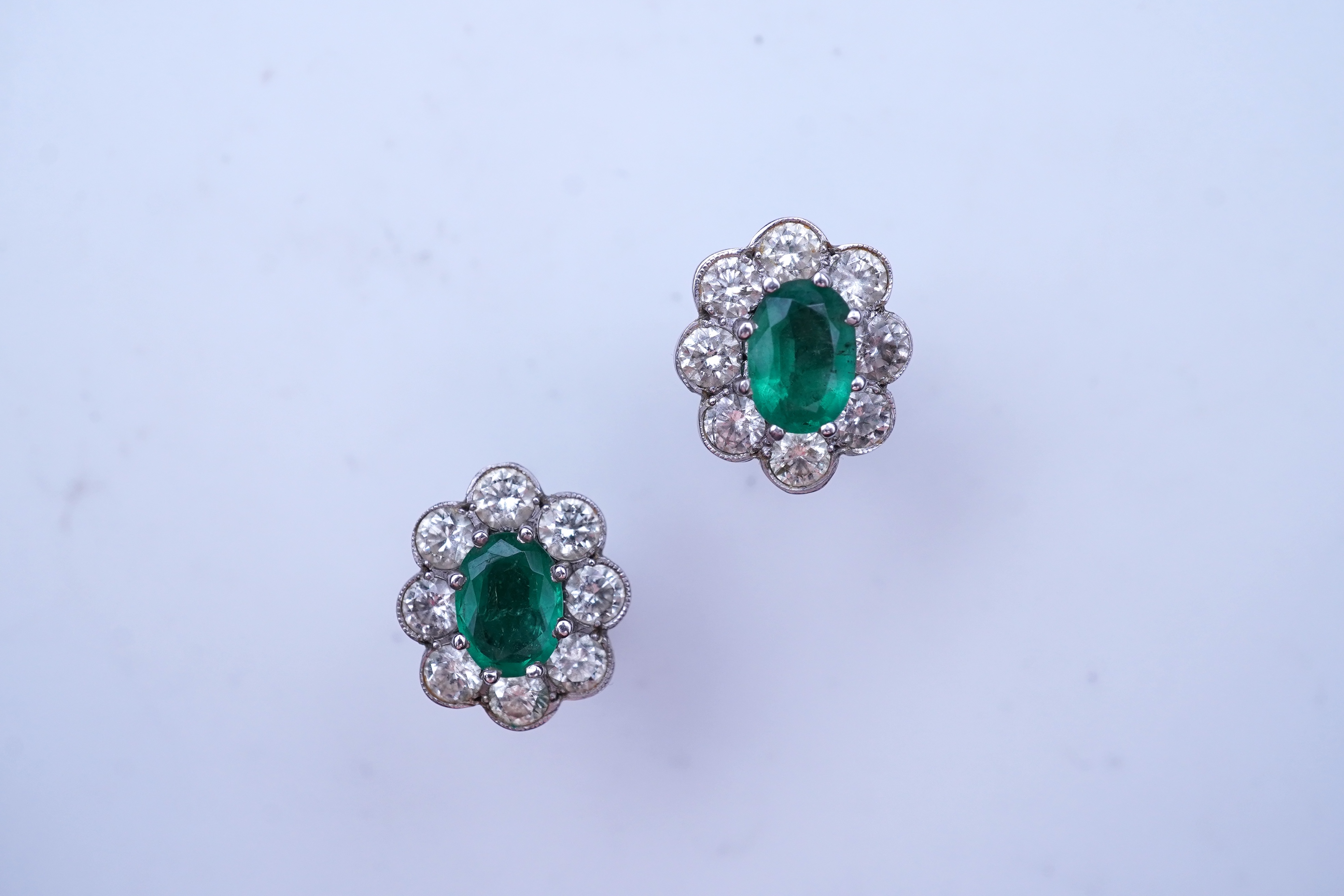 A pair of emerald and diamond earrings